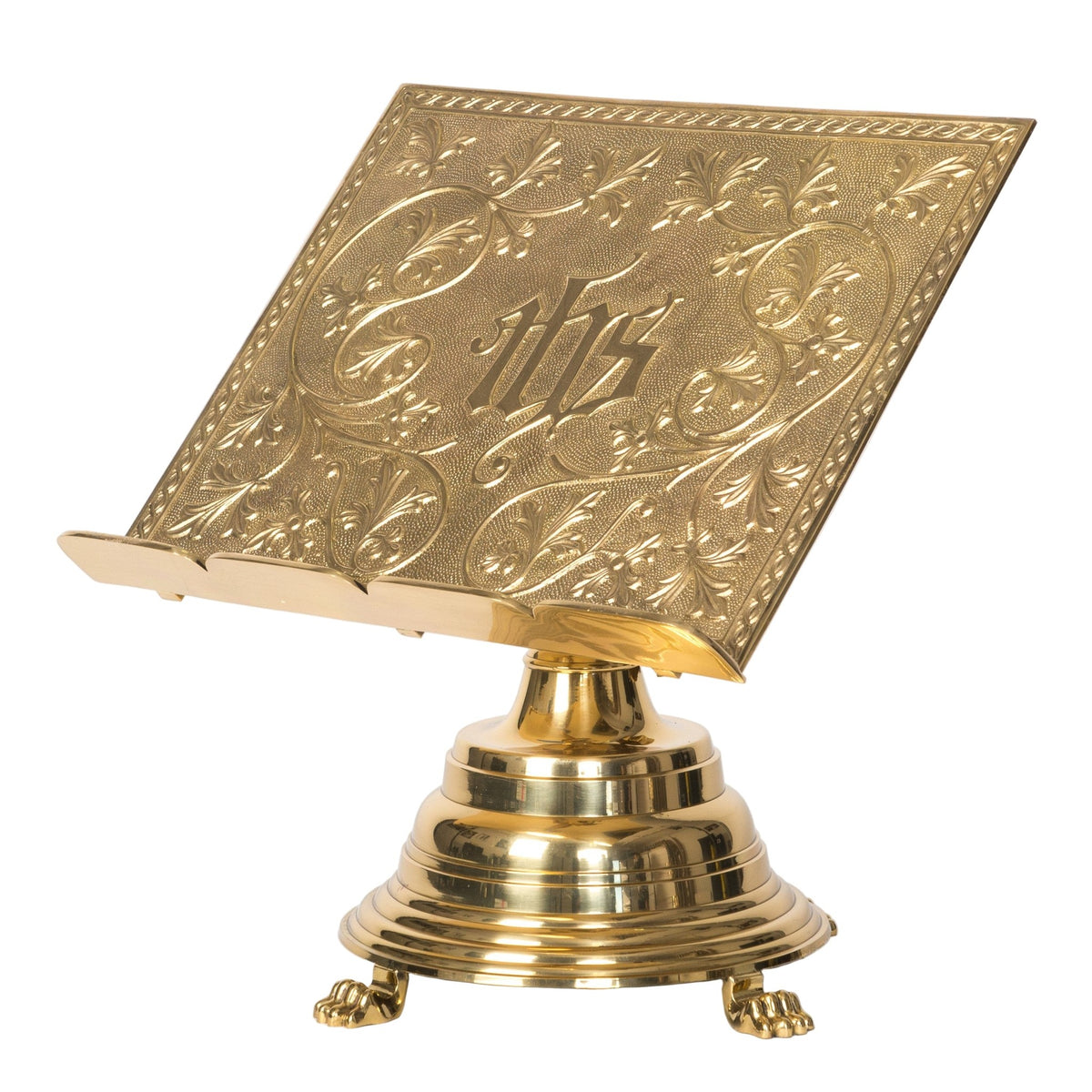 Gold-tone missal stand with embossed IHS book rest on a round bell-shaped base with claw feet