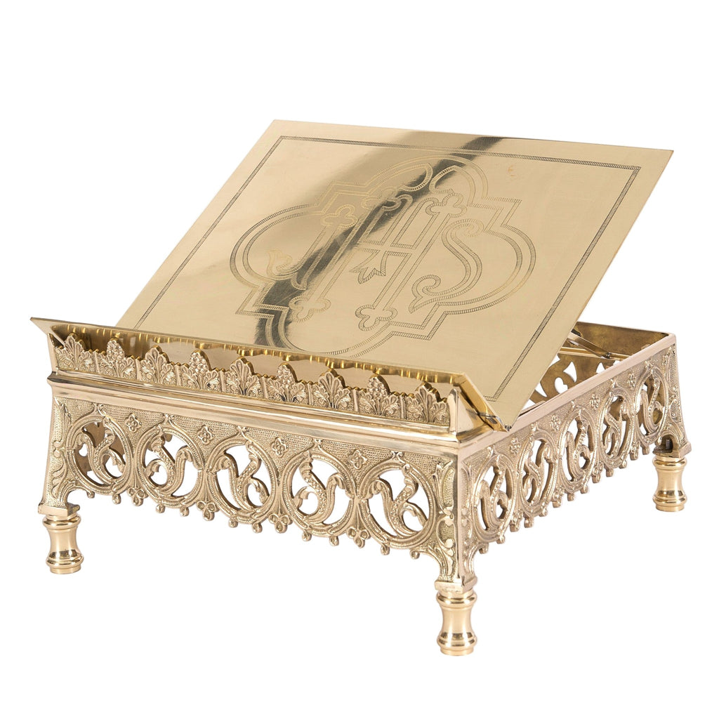 Adjustable brass missal stand with engraved IHS book rest on a pierced Gothic base with feet