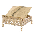 Adjustable brass missal stand with engraved IHS book rest on a pierced Gothic base with feet