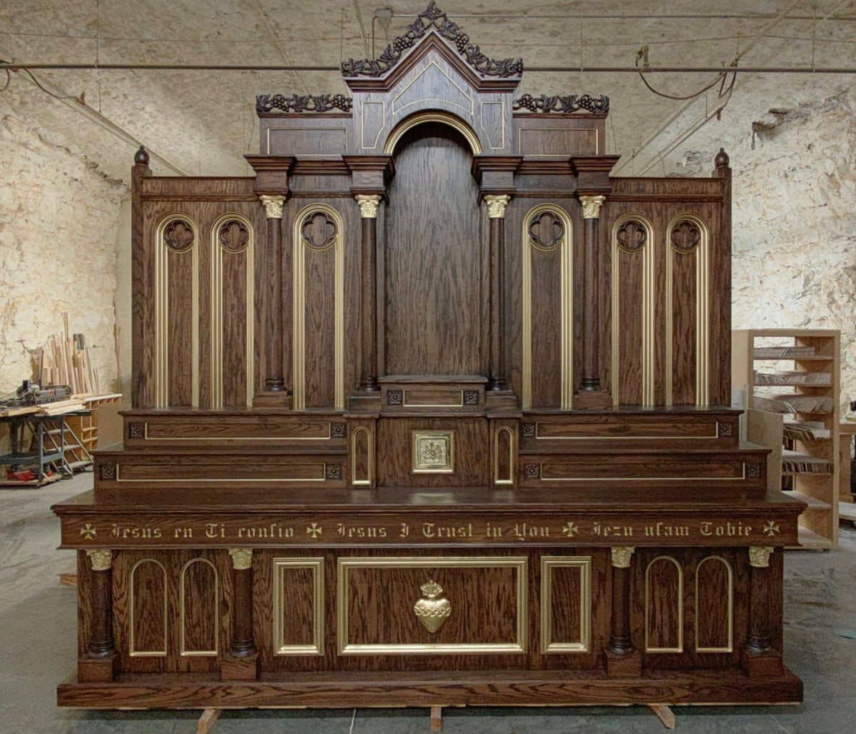 A twelve-foot carved oak high altar, The Saint Brigid, built by Fynders Keepers