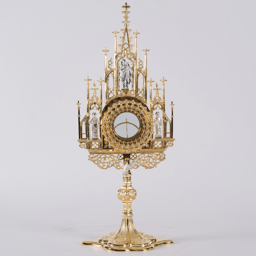 Gold Gothic monstrance with spires and small silver saint figures